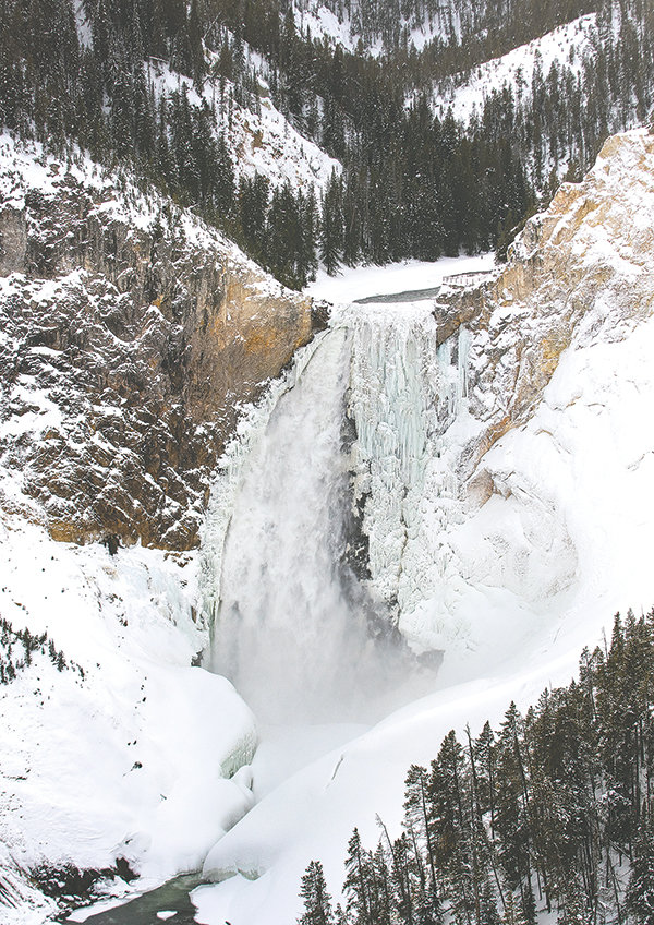 The Lower Falls of the Yellowstone River, as seen from the Lower Falls Overlook as it plunges into the Grand Canyon region of Yellowstone National Park, is mostly frozen during the winter season. This photo was captured on Dec. 28, a little more than a week before a treasure hunter climbed down into the canyon looking for a famous treasure.