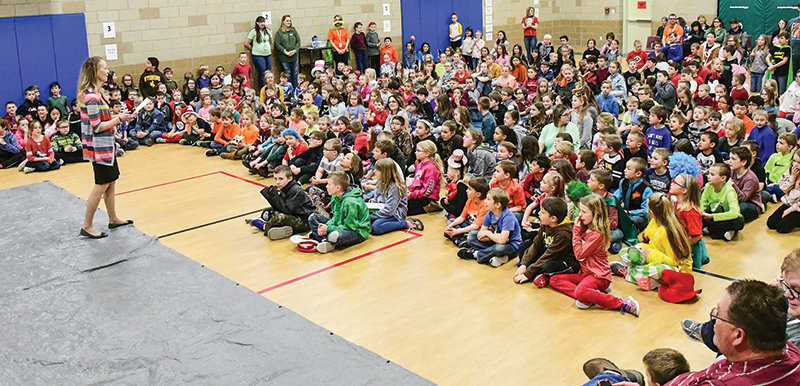 Principal Angela Woyak (left) talks with Westside Elementary School students and staff before being slimed on March 6. A total of 92% of Westside students participated in the Read-a-thon, reading at least 20 minutes every evening of the two-week event. It was one of the final all-school events before spring break, which started Monday for Powell students. The Powell school district announced Monday that it is canceling school and all school related activities until April 3.