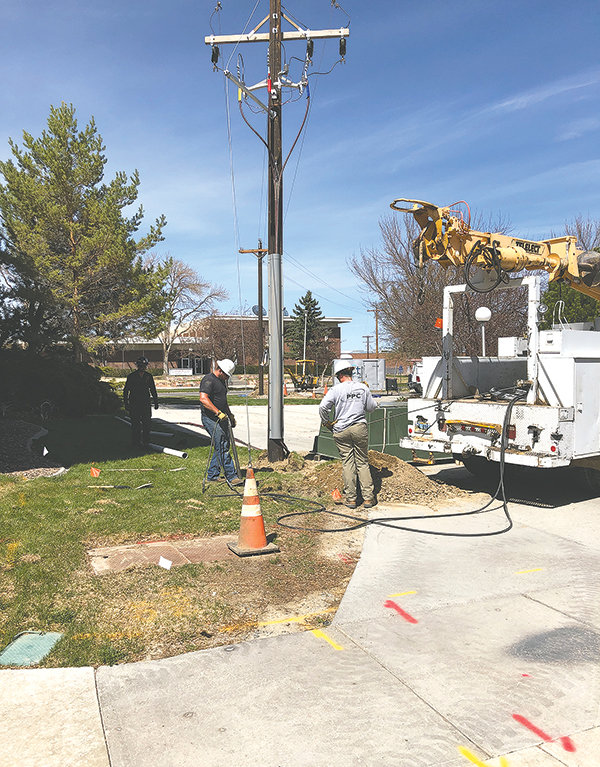 The new power poles set up on the Northwest College campus are only temporary. Crews with Intermountain Electric of Powell erected the poles last week to carry power lines during a system upgrade.