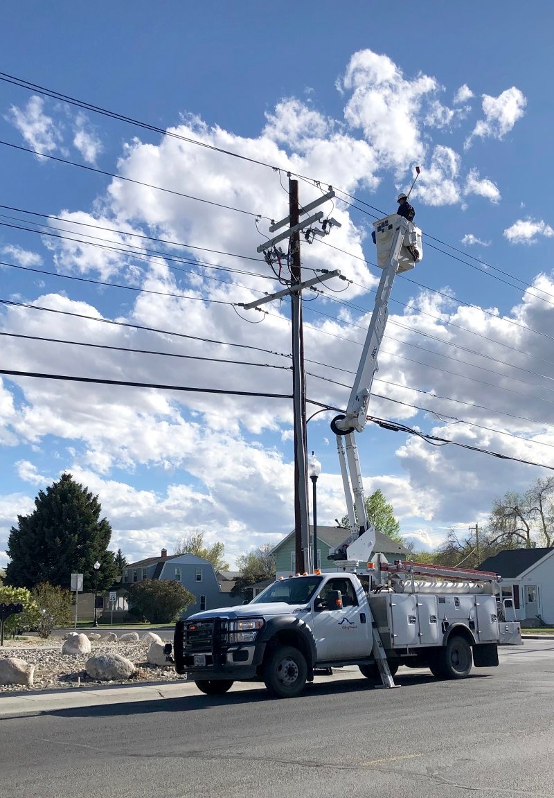 A member of the City of Powell Electric Department works to restore power to a part of the city on Sunday afternoon. A failing arrester led to multiple outages in about a third of the city.