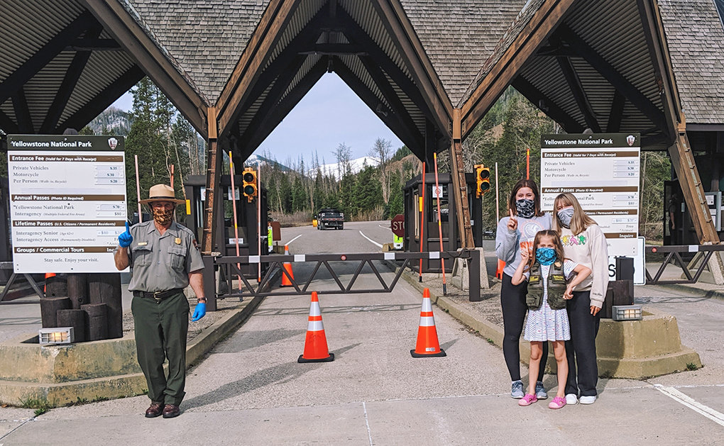 Kiya, Hailey and Grace McIntosh (at right) pose for a photo with Yellowstone National Park’s East Entrance Supervisor Brian Perry on the park’s opening day of the 2020 summer season. The girls and their mother, Stacy Boisseau, were first in line at the East Gate on May 18.