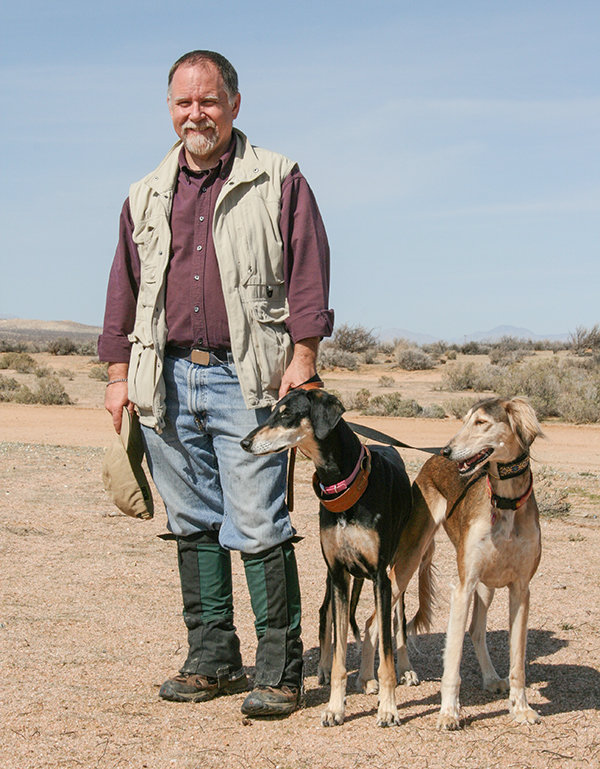 Canine historian Brian Patrick Duggan is pictured with his Salukis, Telek and India.