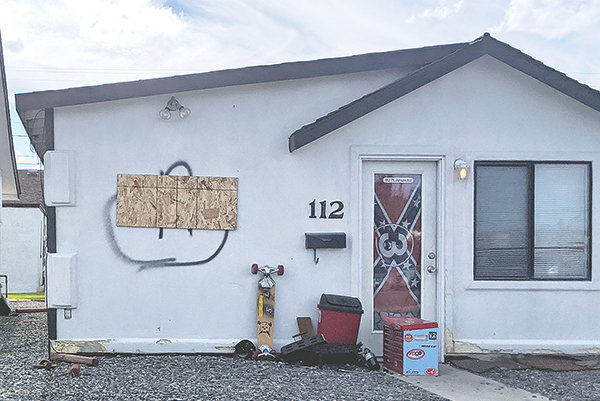 A Powell man spray painted a crude image of a hand extending its middle finger on Saturday. It was censored with plywood Monday afternoon (above) and then painted over on Tuesday.