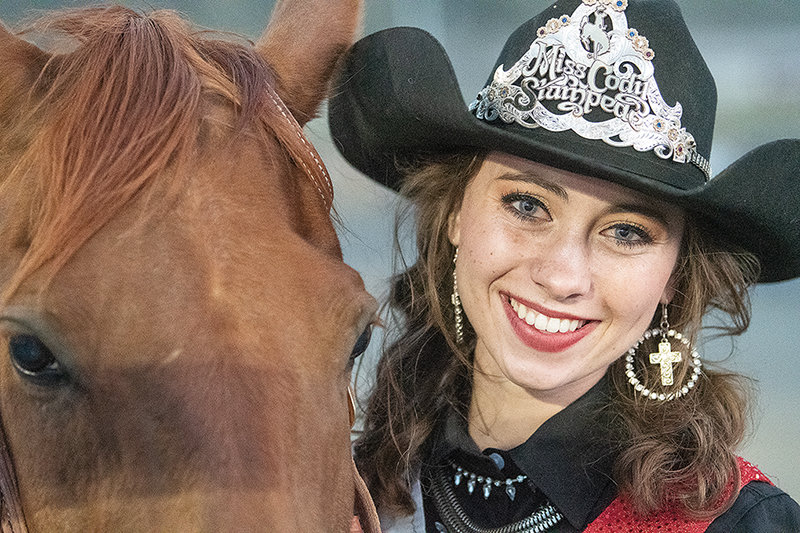 Rylee Ramsey poses with her 2020 Stampede Rodeo tiara and a borrowed horse for her first performance since her accident last year.