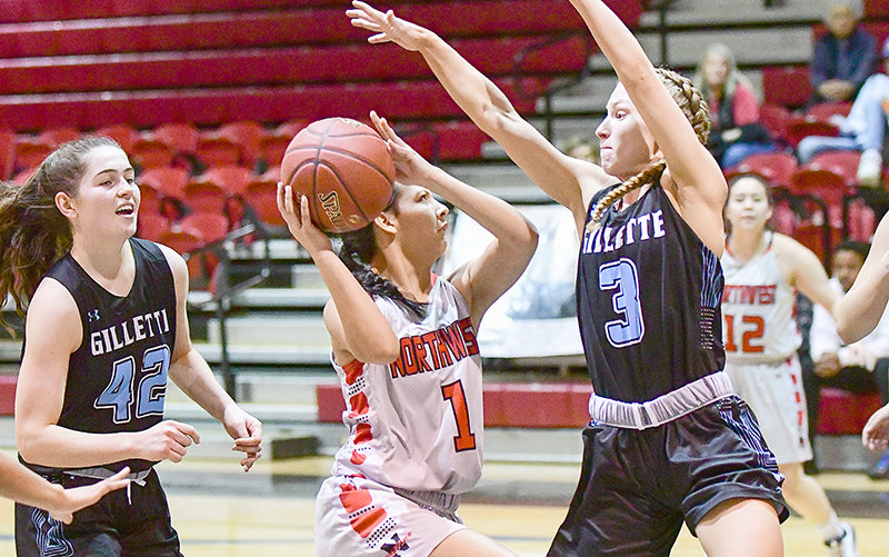 Gillette College’s Skylar Patton (at right) and Molly Coleman (at left) look to shut down NWC freshman Kendall Wright during a contest at the Cabre Gym last year. Leaders of Gillette and Sheridan colleges — which compete in NJCAA Region IX alongside the Trappers — announced last week that they’re cutting all of their athletic programs outside of rodeo.