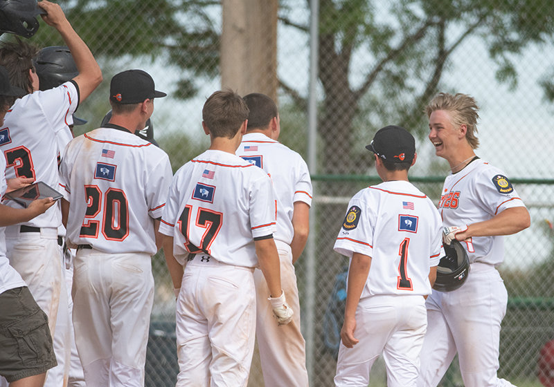 Outfielder Kobe Ostermiller is congratulated by his teammates after hitting his first career home run on Saturday — a grand slam against the 406 Flyers of Billings. After losing four games last week, the Powell Pioneers sit at 6-9 on the season.