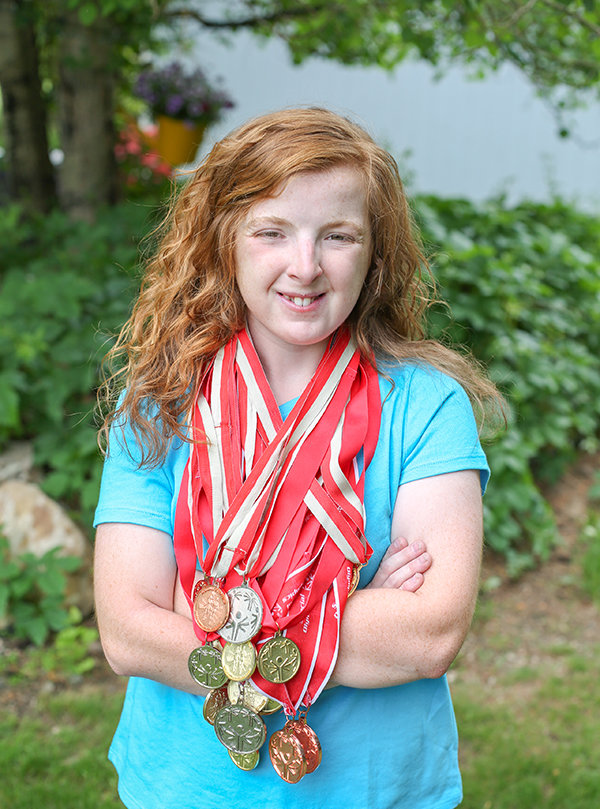 Emma Foley of Cody is pictured with some of her medals from Special Olympics. Proceeds from the 2020 Compete for a Cause will benefit Special Olympics Wyoming in honor of Foley. Performers are currently being sought for the show.