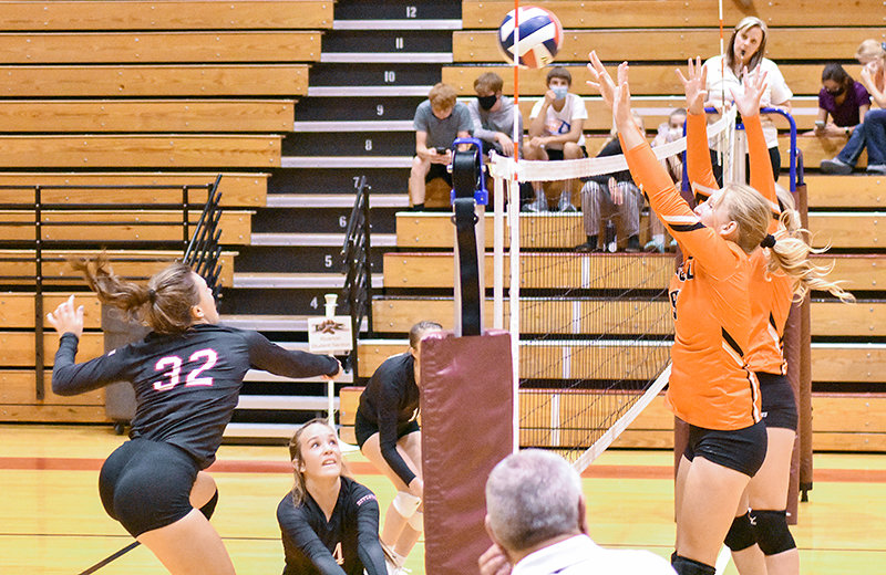 PHS senior Rose Graft (right) goes up for a block against Riverton on Friday. The Panthers opened the 2020 campaign with a three-set win.