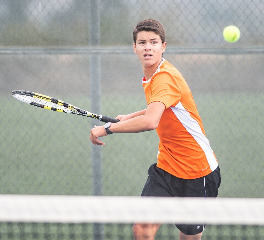PHS No. 1 singles player Ethan Bartholomew prepares to return a shot earlier this season. He and the Panthers fell in Cody on Thursday and are hosting Rawlins on Saturday.