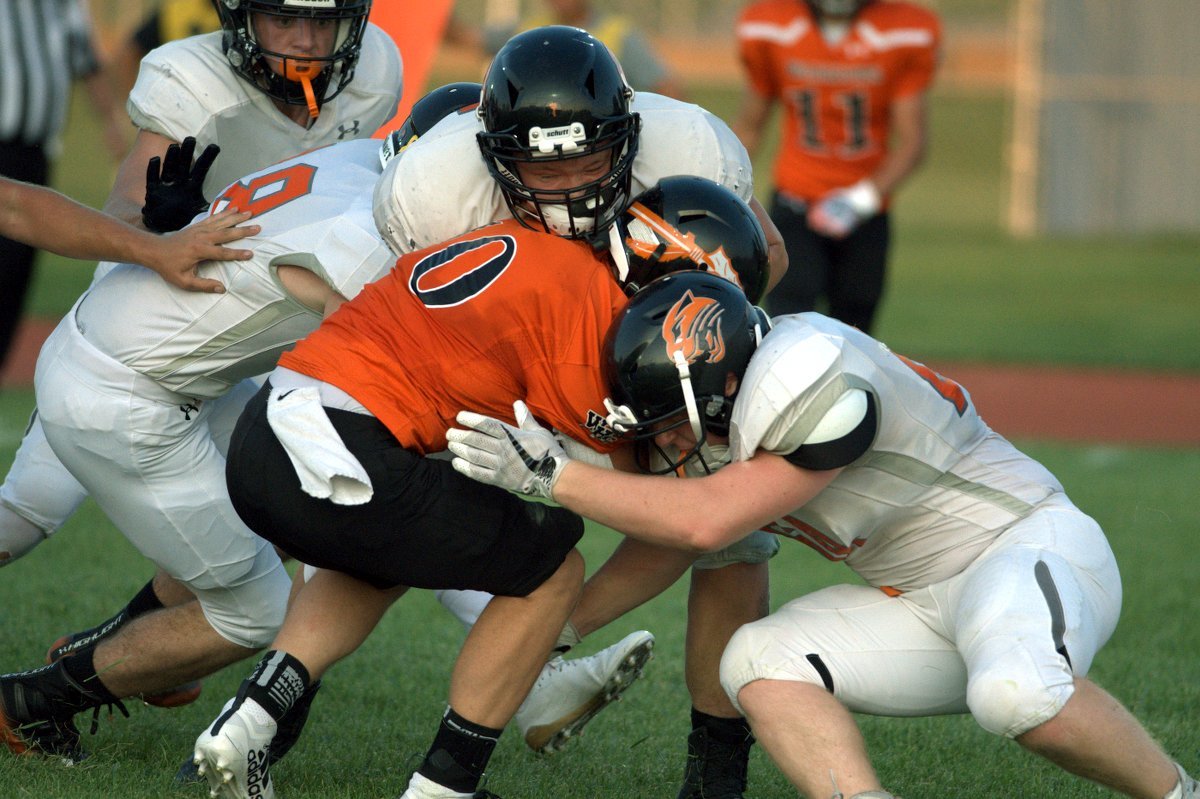 A group of Panthers swarm Warrior running back Taylor Pierce in Powell's 41-6 win on Friday in Worland. Powell held Worland to just 6 rushing yards in the win.