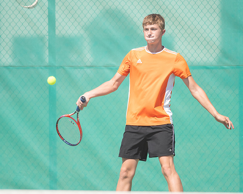 PHS junior Logan Brown prepares to smack the ball in the Panthers’ match against Rawlins on Saturday. Brown and his No. 1 partner, Kolt Flores, didn’t surrender a game.