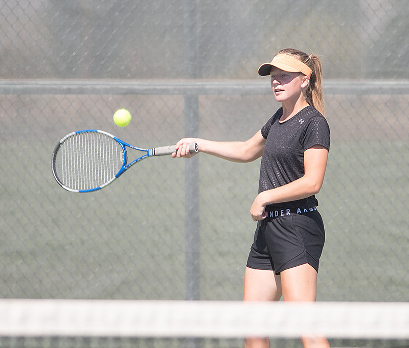 PHS senior Sophe Morrow returns a serve during the tennis team’s final home match of the year. Morrow and Sydnee Thompson, who usually play No. 1 doubles, played an exhibition against Sami Cole and Katy Asay due to a Rawlins forfeit.