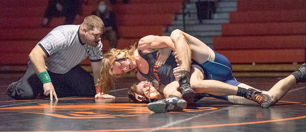 PHS wrestler Mikey Timmons, on top, competes against Cody’s Gavin Vance on Tuesday, Jan. 12. The Panthers went 4-2 in their most recent stretch of events, defeating Lovell, Cody, Mountain View and Rawlins.
