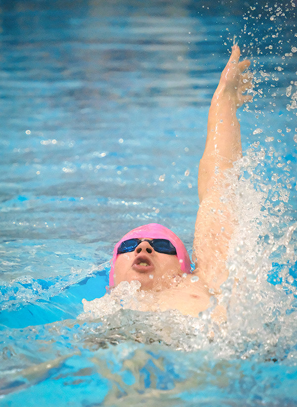Powell High School senior Tarren Blackmore swims the backstroke leg of the 200 individual medley Friday in Cody. Blackmore finished first in the individual medley and was also a member of the first-place 400 free relay team at the meet.
