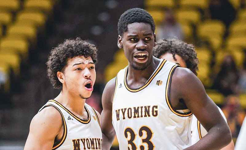 Marcus Williams, left, Graham Ike, center, and the rest of the Wyoming Cowboys basketball team will face off with San Diego State twice in the coming days.