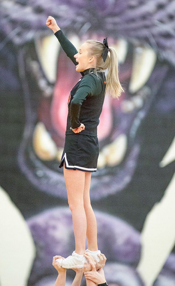 Morgan Schmidt participates in a cheer in first half action during Powell’s basketball game against Cody. The PHS cheer and dance teams competed Thursday in Casper for the State Spirit Competition.
