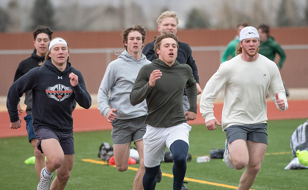 Powell High School sprinters (from left) Dylan Escalante, Riley Bennett, Zach Ratcliff, Reed Smith, Toran Graham and Sam Whitlock warm up Tuesday at practice.