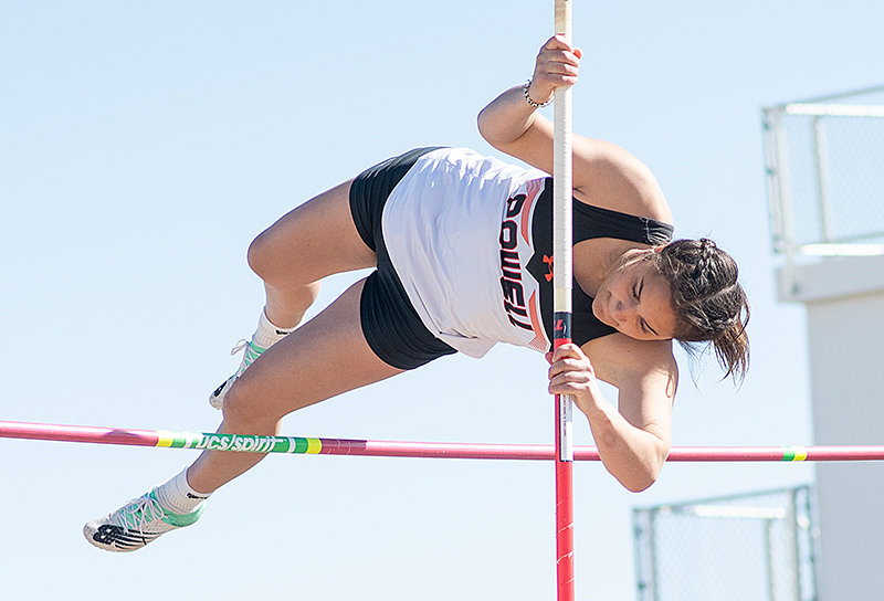 Emma Karhu clears the bar in the pole vault at Saturday’s L.A. Kohnke Powell Athletic Roundtable Invitational. Both the girls’ and boys’ track and field teams finished first at the meet.