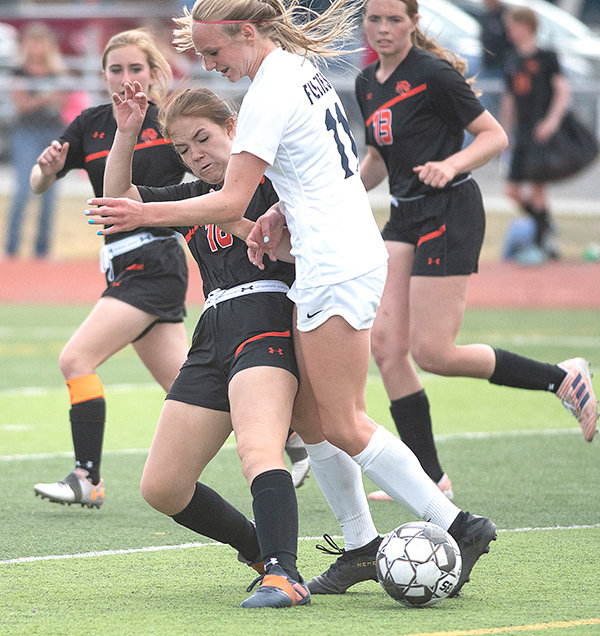 PHS sophomore Madelyn Hedges attempts a tackle in Powell’s Thursday loss to Cody. The Panthers hope to build on their recent improvement as they wrap up the regular season, facing Mountain View and Lyman on the road this week.