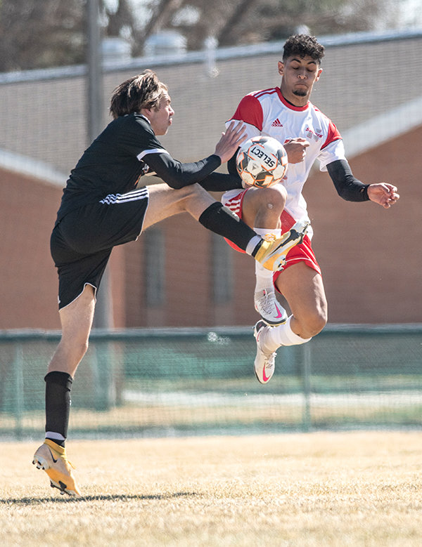 Northwest College’s Aimane Sharaoui (right) leaps for a ball in a match against Central Wyoming earlier this season. Despite a stagnant stretch in the middle of NWC’s most recent match against Western Nebraska, the Trappers prevailed with a 3-2 win.