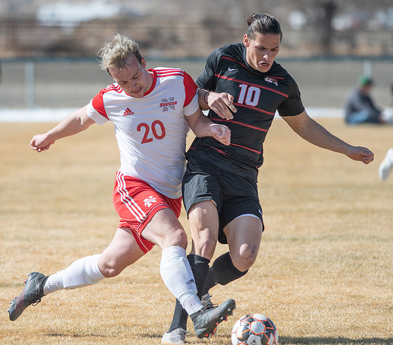 Thomas Mullen scrambles for a ball with Casper’s Kevin Tauzia in Northwest College’s first meeting with Casper. NWC will not host a Region IX Tournament game after falling 1-0 to LCCC.
