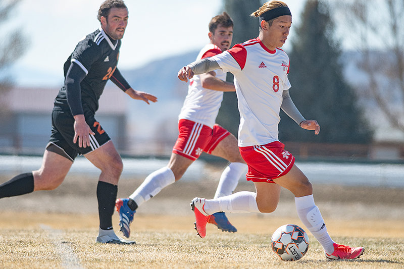 Taiga Tanabe drives into the box in NWC’s April match against Central Wyoming. Before the fall season, head coach Rob Hill hopes his team works on becoming mentally stronger.