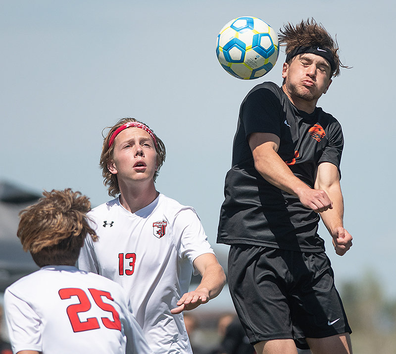 Jack Pool goes for a header Thursday in Powell’s 3-2 win over Riverton. Pool is one of several seniors who will graduate from the program.