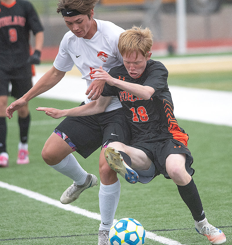 Junior Hawkin Sweeney fights for a ball with Worland’s Jackson Wassum. As soon as Powell lost, head coach David Gilliatt’s focus switched to next season, he said.