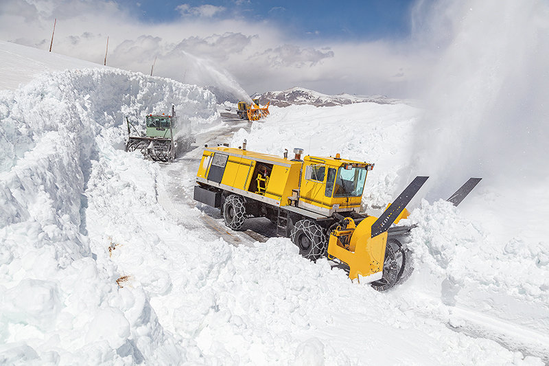 National Park Service crews clear massive piles of snow from the Beartooth Highway on May 19. The high-mountain route is set to open to travelers on Friday morning.