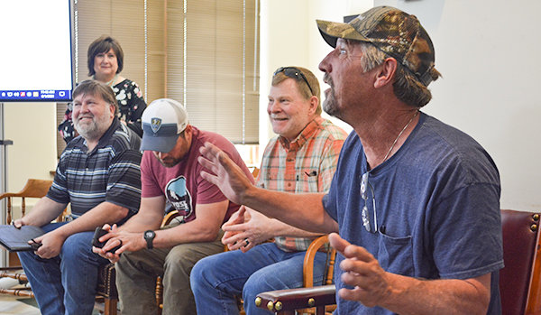 Ron Nieters speaks Tuesday about his nearly four decades working in the Park County Road and Bridge Division, as county employees (from left) Brian Edwards, Susan Kohn (back), Trapper Marsh and Aaron Rose listen.