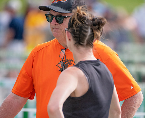 Scott Smith speaks with a coach at the 3A State Track and Field Meet in Casper. Smith, who has coached in Powell for almost three decades, said it is ‘an honor to be able to represent our entire coaching staff and team’s efforts this year.’