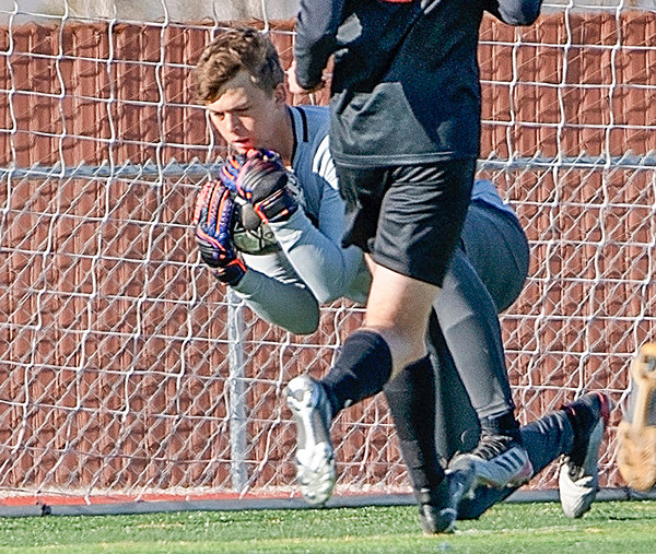 Ashton Brewer makes a save against Lander Valley in the 2021 season. Brewer valued NWC’s proximity to home and the leadership of head coach Rob Hill.