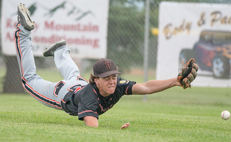 Outfielder Ryan Cordes lays out for a ball Wednesday against the World Showcase team. After a couple underwhelming performances, the Pioneers crushed their competition in Green River, outscoring opponents 42-3 in four games.
