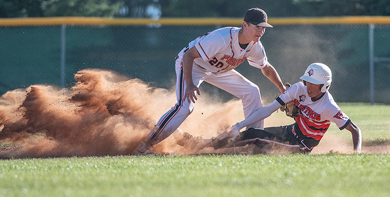 Trey Stenerson tags a runner out at second base in game two of Powell’s Monday doubleheader against the Lovell Mustangs. An improved dugout mentality helped the Pioneers push head of the Mustangs in the second game, manager Joe Cates said.