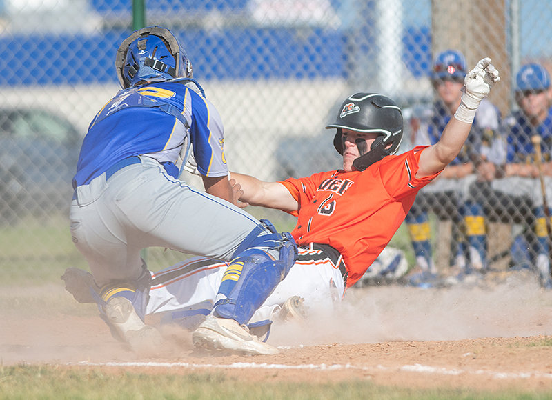 Pioneer Jhett Schwann slides into home plate during Thursday’s action against Cody. Poor pitching and defense spelled a sweep for the Powell squad, which will be looking for revenge in a rematch in Cody today (Tuesday).