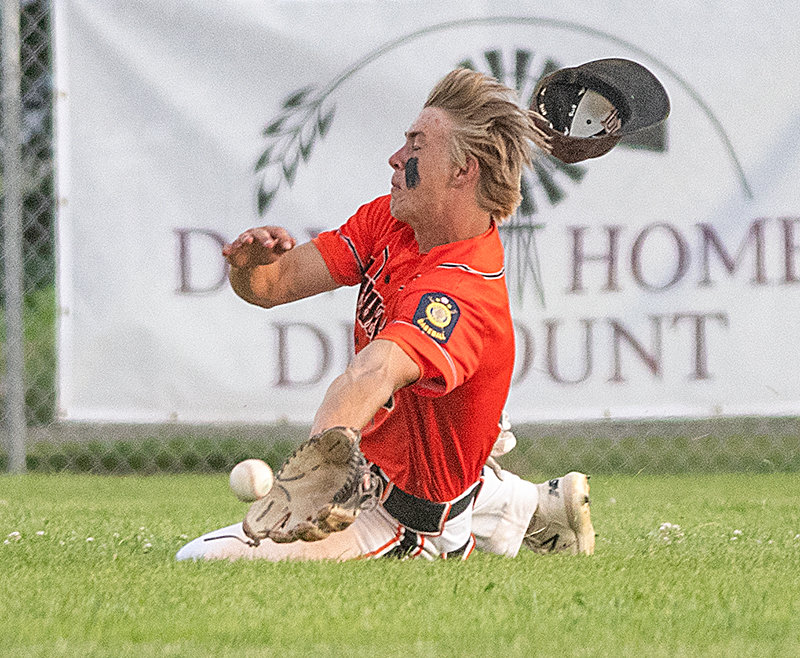 Kobe Ostermiller dives for a ball during a Thursday game against Cody. The Pioneers were swept by the Cubs, but will look to bounce back this week.