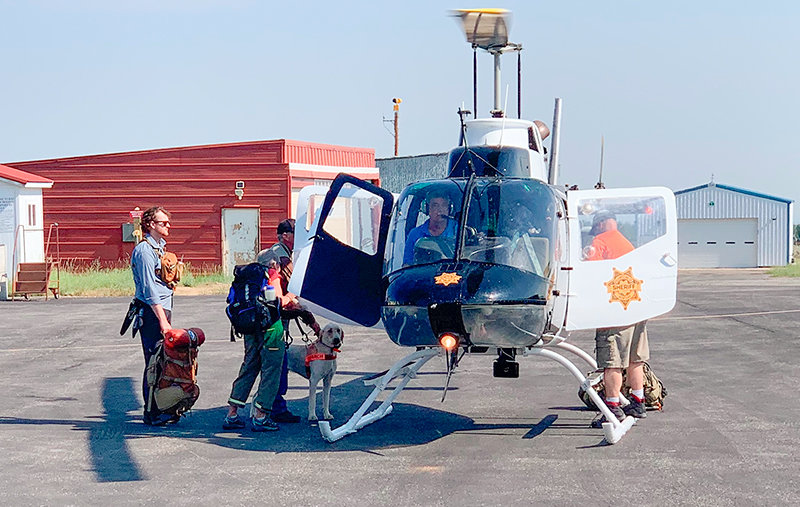 Searchers prepare to board a Yellowstone County, Montana, Sheriff’s Office helicopter last week as part of efforts to locate missing hiker Tatum Morell. Extensive searching did not locate Morell, leading authorities to conclude that she likely has died.