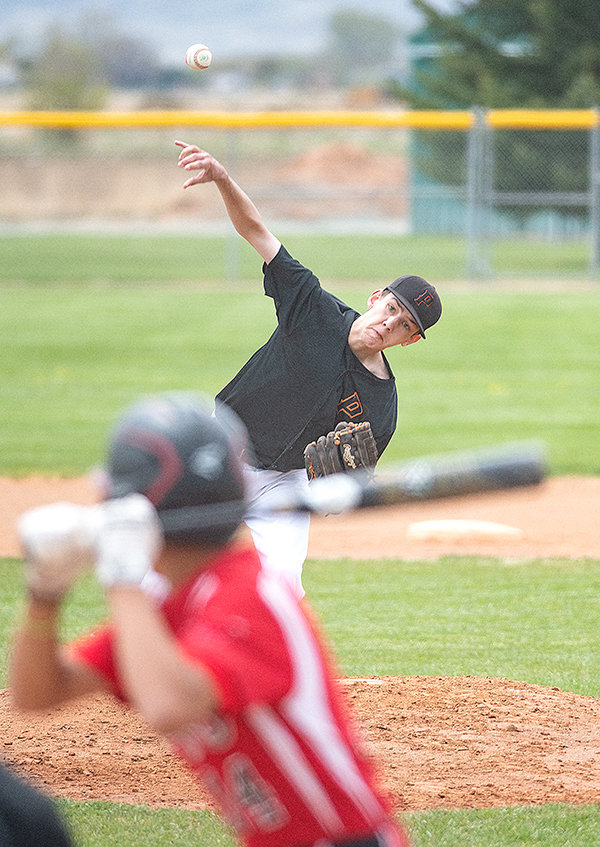 Jacob Gibson throws a pitch earlier in the season against the Lovell Mustangs. The Pioneers will compete at the state tournament in Gillette this weekend.