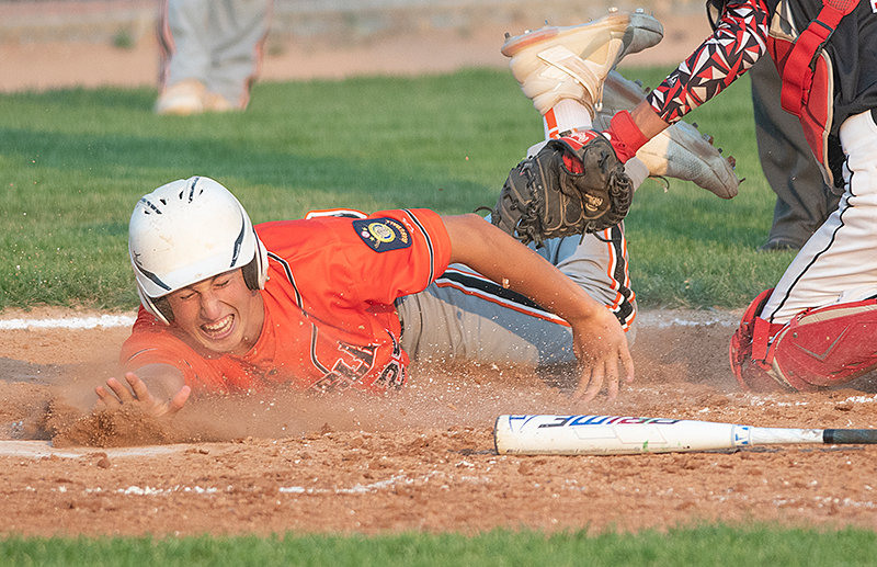 Cade Queen tries to avoid a tag in Monday’s doubleheader against the Lovell Mustangs. Powell swept the Mustangs, improving to 27-9 overall and ending a four-game skid.