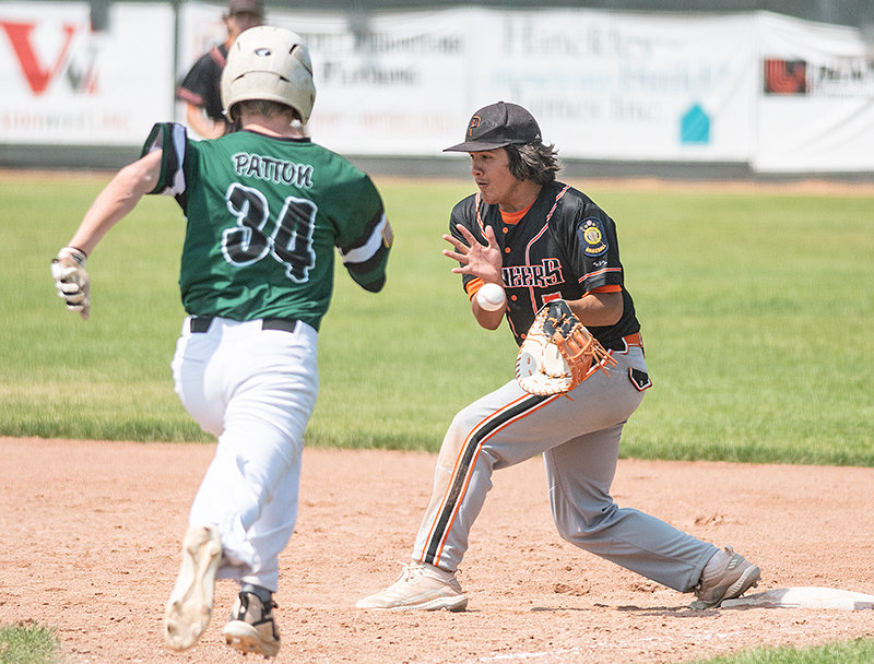 First baseman Kolt Flores attempts to catch a ball in the seventh inning of Saturday’s game against Green River. Powell’s only loss of the weekend came to the Knights, who walked it off in the final inning.