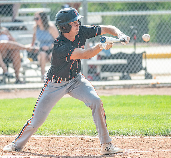 Kobe Ostermiller lays down a sacrifice bunt Saturday in the Pioneers’ win over Rawlins. Powell played small ball last weekend, bunting more frequently.