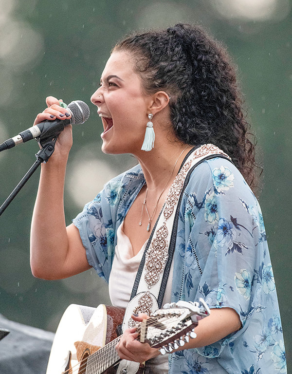 Powell resident Tia LeeAnn Ibarra was the opening act for the Sam Cox Band Thursday night. She played several originals and a few cover tunes amid the rain.