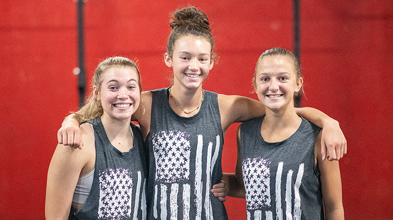 Maddie Campbell, Saige Kidd and Alexa Richardson pose for a photo at Freedom Fitness. The three Powell High School students excelled at a recent functional fitness competition, Summer Crush, placing 11th out of 27 teams.