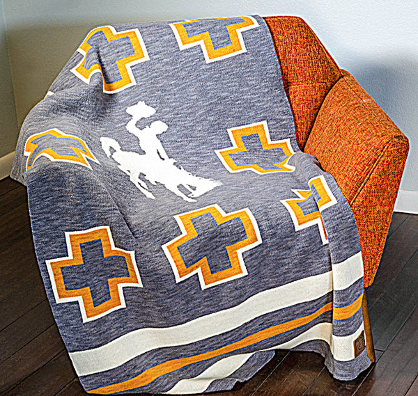 Wool shorn from sheep at the Laramie Research and Extension Center was processed and knitted into limited-edition, University of Wyoming-themed throws. The wool for each blanket comes from UW’s heritage breed of sheep developed at the university 100 years ago.