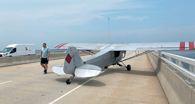 Landon Lucas walks along the Ocean City-Somers Point bridge in New Jersey after being forced to make an emergency landing on July 19. A recent graduate of Northwest College’s aeronautics program, Lucas was able to avoid injury and damage after experiencing an engine failure.