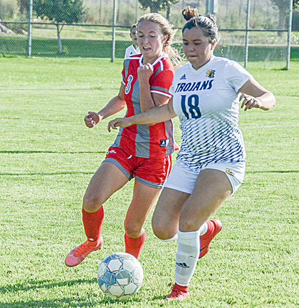 Trapper midfielder Kameron Stitt looks to win the ball back from Trinidad State’s Natalie Flores on Friday. On their weekend road trip to southern Colorado, the NWC women earned victories against Trinidad and Otero Junior College for the first time in school history.