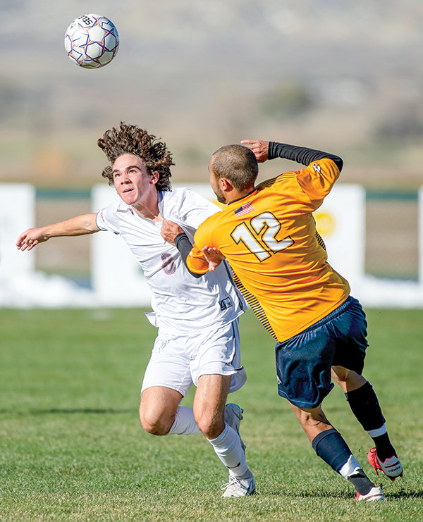 Midfielder Cody Shrum (left) chases after his own header as he attempts to work his way past the Western Nebraska defender. The Trappers would go on to lose 4-2 against Western Nebraska and 2-0 against Northeastern. The Trappers will head to Casper for a playoff game on Saturday.