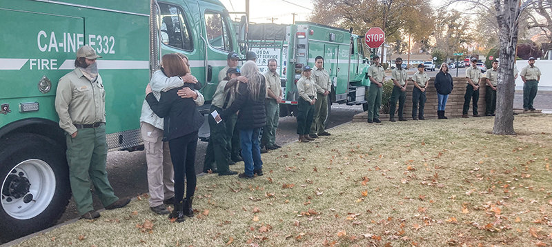 U.S. Forest Service personnel from the Inyo National Forest in Bishop, California, greet Janet Reed-Bradley and Sierra Bradley-Warfel, Layla Bradley’s mother and sister, as Layla begins her trip home.