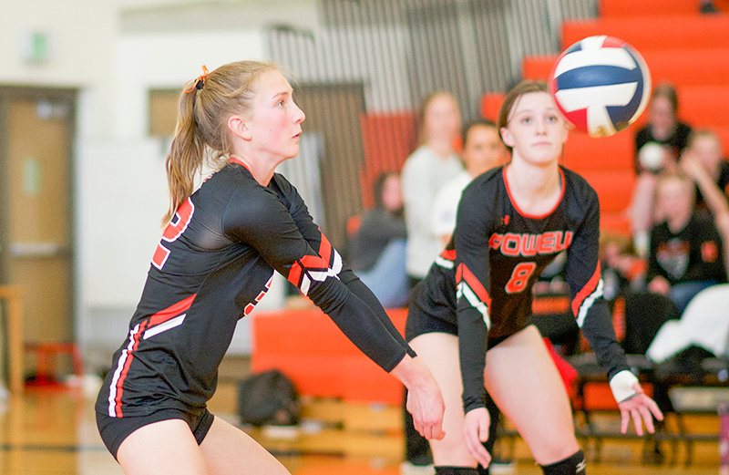 Powell High School freshman Kenna Jacobsen (left) receives the ball alongside junior teammate Waycee Harvey and passes it to the front line during a JV match on Oct. 22 against Lovell. The Panthers finished the season with two tournament wins and a 20-10 record.