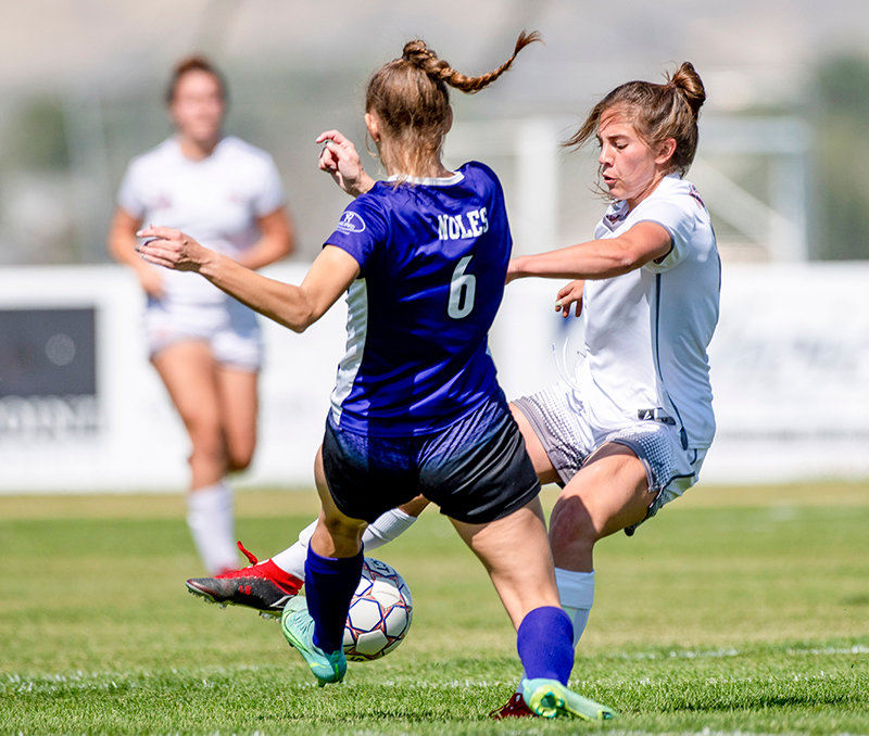 Freshman forward Peyton Roswadovski puts in a tackle during the Trapper’s match against the Gillette Edge on Sept. 12. Roswadovski was named the Region IX Freshman of the Year after scoring 15 goals, tied for 17th in the NJCAA.